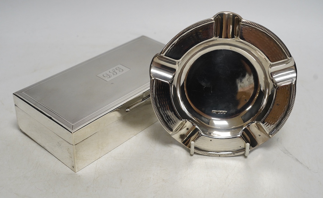 A 1960's engine-turned silver mounted rectangular cigarette box, 17.8cm and a silver ashtray. Condition - fair